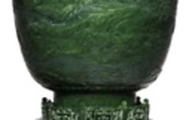 A CARVED SPINACH GREEN JADE LANTERN