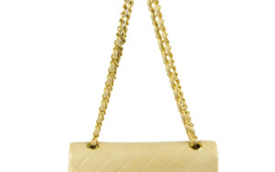 CHANEL - a vintage beige Medium Classic Double Flap handbag. View more details