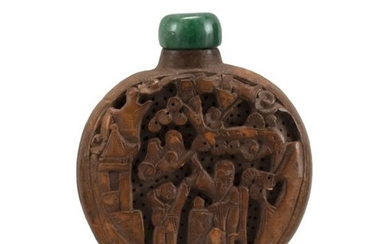 CHINESE CARVED WOOD SNUFF BOTTLE In flattened ovoid form, with pierced and relief figural landscape design. Height 2.4". Green stone...