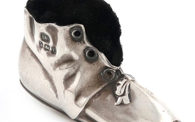 An Edwardian novelty silver boot pin cushion, by...