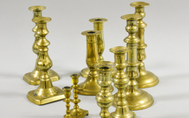 Four Pairs and Two Single Brass Candlesticks