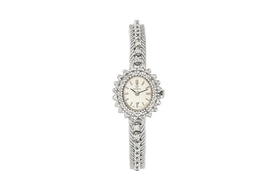 Omega. A lady's 18K white gold and diamond set manual wind bracelet watch