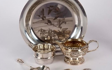 A silver plate with design by Peter Scott, John