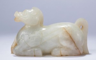 A WHITE JADE CARVING OF A MYTHICAL BEAST