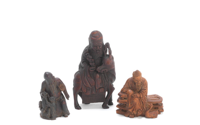 A group of three bamboo carvings