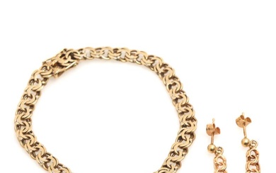 A 14k gold bracelet and a pair of 18k gold earrings. L....