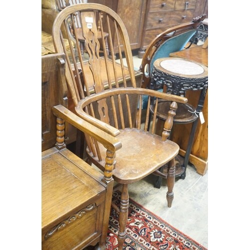 A 19th century Windsor elm and beech armchair, width 58cm de...
