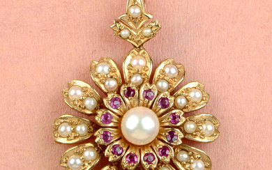 A 9ct gold ruby, cultured pearl and split pearl floral pendant.