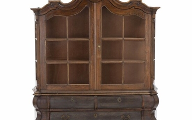 SOLD. A Baroque style oakwood display cabinet. Danish manufacture based upon Dutch design, early 20th century. H. 205 cm. W. 155 cm. D. 52 cm. – Bruun Rasmussen Auctioneers of Fine Art