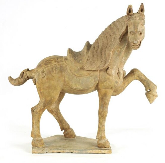 A CHINESE EARTHENWARE MODEL OF A TANG HORSE with