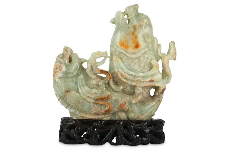 A CHINESE PALE CELADON JADE ‘DOUBLE DRAGON FISH' CARVING.