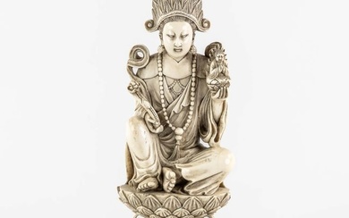 A Chinese Buddha holding a Ruyi and Buddha, sculptured ivory. Circa 1900. (L:10,5 x W:12,5 x H:25,5