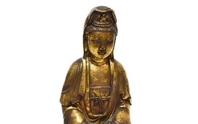 A Chinese Gilt Bronze Figure of Guanyin, late Ming Dynasty,...