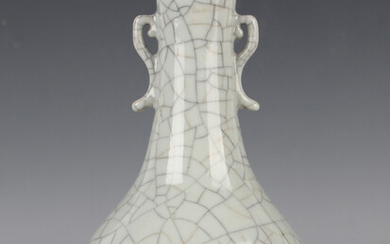 A Chinese crackle glazed bottle vase, the low-bellied body and slightly flared narrow neck covered i