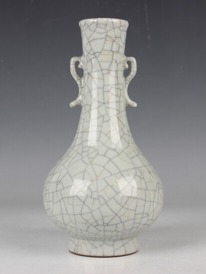 A Chinese crackle glazed bottle vase, the low-bellied body and slightly flared narrow neck covered i