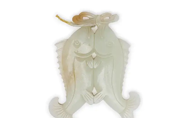 A Chinese pale green jade ‘twin-fish’ pendant 20th century Carved inform of...