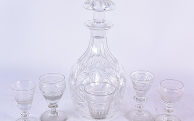 A Cut Glass Decanter with Five assorted Glasses. Decanter 2...
