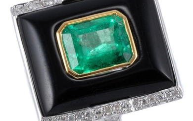 A DECO INSPIRED EMERALD DIAMOND AND ONYX RING; rectangular cabochon onyx centre bezel set in yellow gold with an emerald cut emerald...