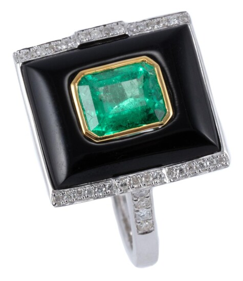 A DECO INSPIRED EMERALD DIAMOND AND ONYX RING; rectangular cabochon onyx centre bezel set in yellow gold with an emerald cut emerald...