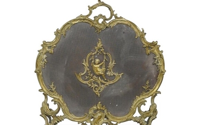 A French gilt bronze fire screen, late 19th century, with foliate scroll border set with a cherub cartouche, 71cm x 66cm Provenance: The Geoffrey and Fay Elliot collection.
