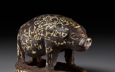 A GOLD AND SILVER-INLAID IRON FIGURE OF A PIG, WARRING STATES PERIOD TO HAN DYNASTY