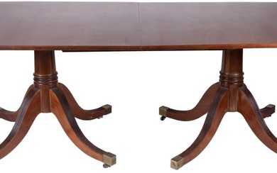 A George III style mahogany extending dining table. One...