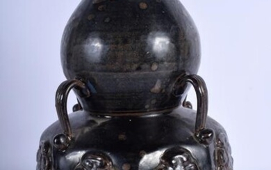 A LARGE CHINESE POTTERY VASE decorated with buddhistic