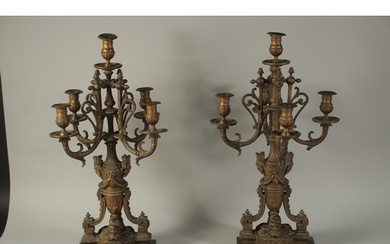 A LARGE PAIR OF 19TH CENTURY ORMOLU CANDLESTICKS with four s...
