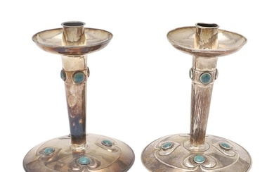 A PAIR OF EDWARDIAN ARTS & CRAFTS SILVER CANDLESTICKS, BY A....
