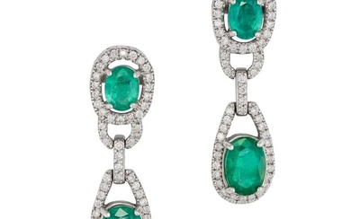 A PAIR OF ZAMBIAN EMERALD AND DIAMOND DROP EARRINGS each set with an oval cut emerald in a frame of