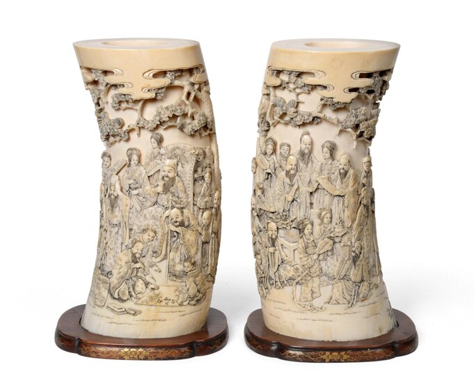 A Pair of Japanese Ivory Tusk Vases, Meiji period, each deeply carved and pierced with...