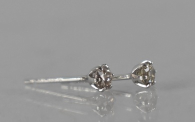 A Pair of Platinum and Diamond Stud Earrings Featuring Round...