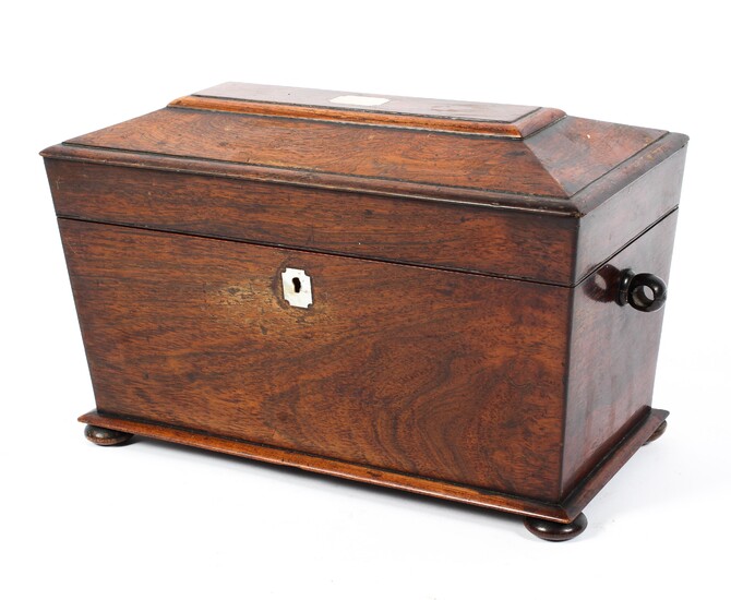 A Regency rosewood tea caddy, of sarcophagus form with mother of pearl escutcheon