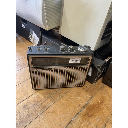 A Sharp portable radio, and various other audio equipment (q...