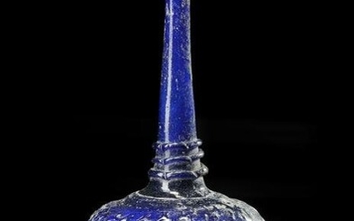 A TALL-NECKED BLUE GLASS BOTTLE, PERSIA OR SYRIA