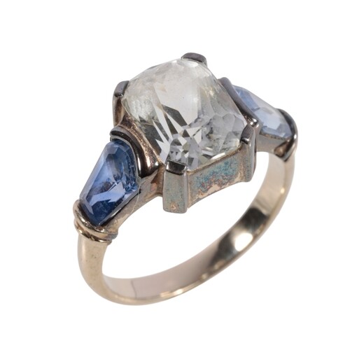 A THREE STONE SAPPHIRE RING the central white sapphire c.10m...