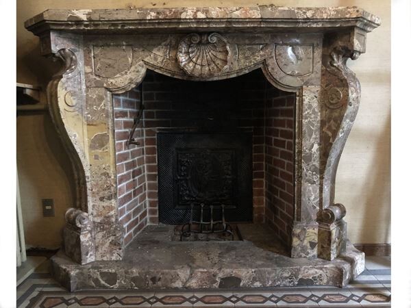 A breccia marble fireplace early 20th century