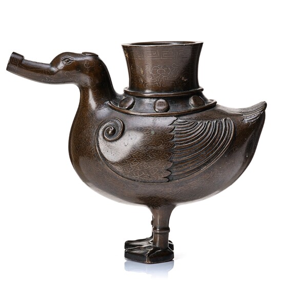 A bronze archaistic duck shaped vessel with silver inlay, Qing dynasty (1644-1912).