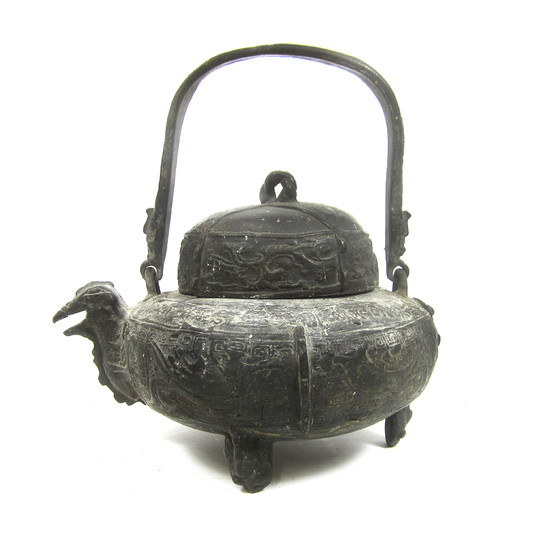 A bronze zoomorphic wine vessel and cover