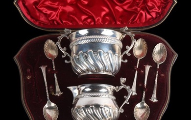 A cased late Victorian silver tea drinking set, Goldsmiths &...