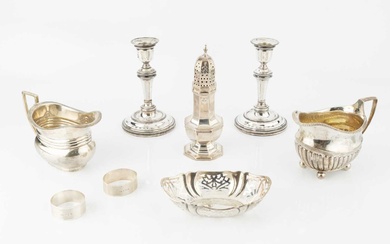 A collection of silver, comprising a George III half-lobed milk...