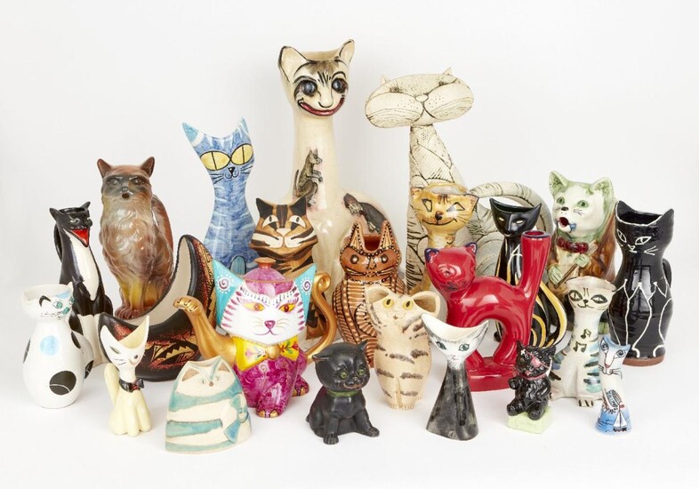 A collection of varying vessels modelled cats, to include; spill vases, jugs, vases, a teapot and others, tallest 42cm high (lot)