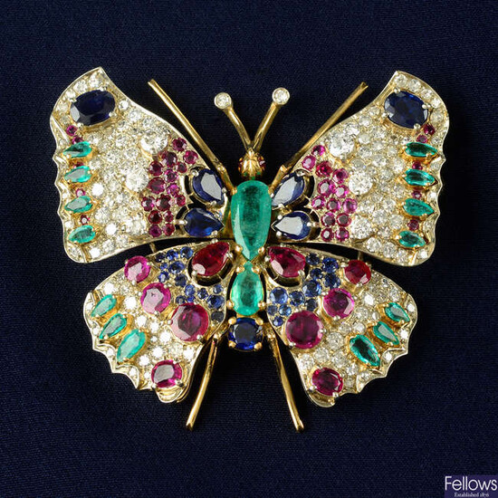 A diamond, emerald, ruby and sapphire butterfly brooch.