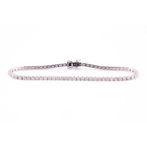 A diamond line 'tennis' bracelet consisting of approximately...