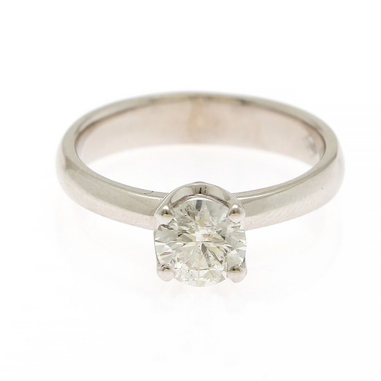 A diamond solitaire ring set with a brilliant-cut diamond weighing approx. 0.80 ct, mounted in 14k white gold. Colour: F-G. Clarity: P. Size 52.