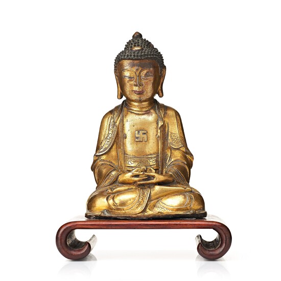 A gilt bronze figure of Amithaba Buddha, Ming dynasty (1368-1644)