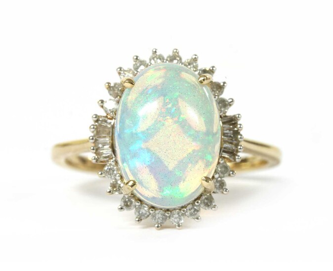 A gold opal and diamond cluster ring