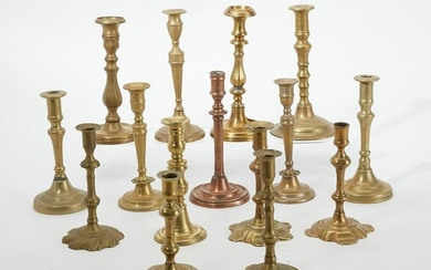 A group of fifteen brass candlesticks