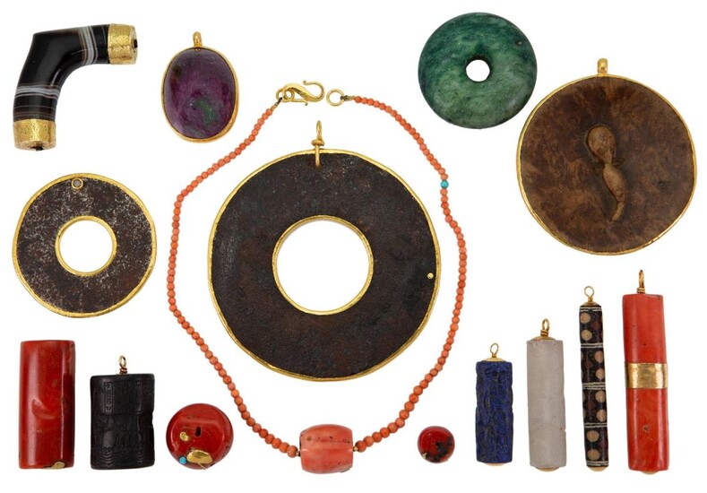 A group of pendants and other items, comprising: a gold mounted coral cylinder, fitting stamped 22ct; a large oval red corundum pendant; two graduated oxidised steel circular pendants, each pendant with a single brilliant-cut brown diamond accent...