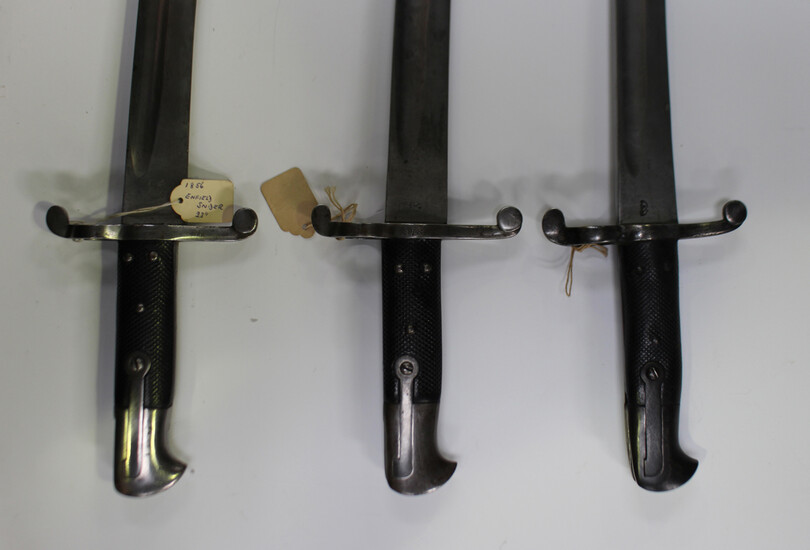 A group of three 1856 pattern Enfield sword bayonets with recurved single-edged fullered blades, bla